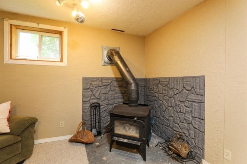 40 S 100 East, Raymond, AB - Indoor With Fireplace