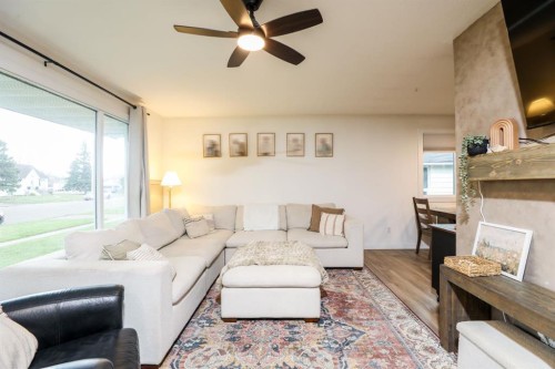 40 S 100 East, Raymond, AB - Indoor Photo Showing Living Room With Fireplace