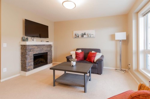 69-51 Keystone Terrace West, Lethbridge, AB - Indoor Photo Showing Living Room With Fireplace