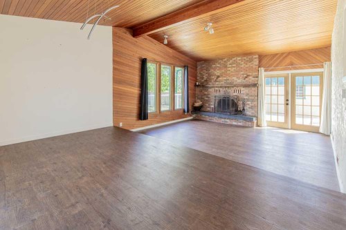 67 E 200 S, Raymond, AB - Indoor Photo Showing Other Room With Fireplace