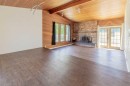 67 E 200 S, Raymond, AB  - Indoor Photo Showing Other Room With Fireplace 