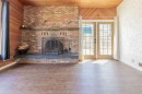67 E 200 S, Raymond, AB  - Indoor Photo Showing Living Room With Fireplace 