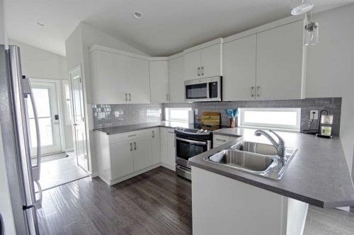 643 Moonlight Lane West, Lethbridge, AB - Indoor Photo Showing Kitchen With Double Sink