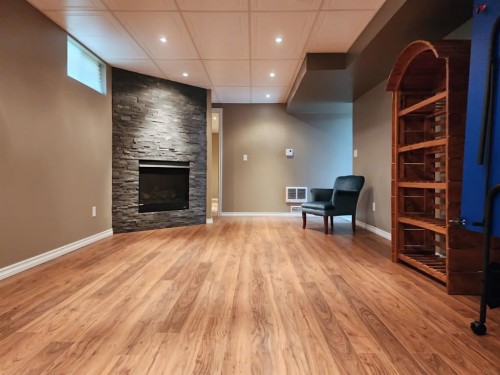 18 Willow Road, Claresholm, AB - Indoor With Fireplace
