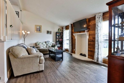 65 Princeton Crescent West, Lethbridge, AB - Indoor Photo Showing Other Room With Fireplace