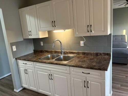 7-1739 St Edward Boulevard North, Lethbridge, AB - Indoor Photo Showing Kitchen With Double Sink