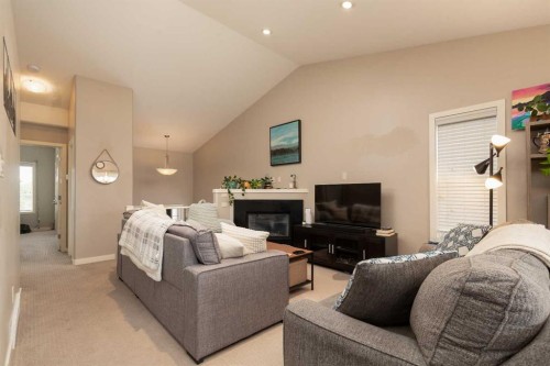 247 Blackwolf Way North, Lethbridge, AB - Indoor Photo Showing Bedroom With Fireplace