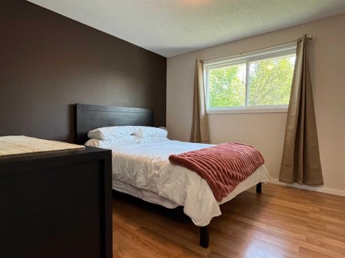 235S 50 West, Raymond, AB - Indoor Photo Showing Bedroom