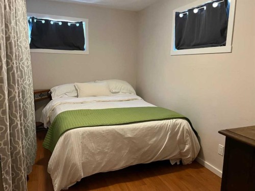235S 50 West, Raymond, AB - Indoor Photo Showing Bedroom