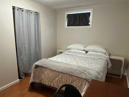 235S 50 West, Raymond, AB - Indoor Photo Showing Bedroom