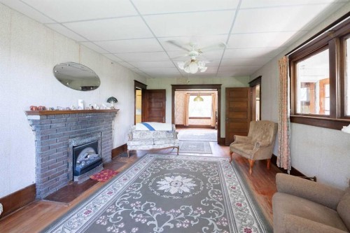 5 4 Street, Champion, AB - Indoor Photo Showing Living Room With Fireplace
