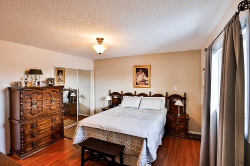 243 N 200 W, Raymond, AB - Indoor Photo Showing Bedroom