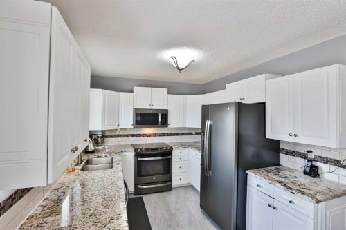 243 N 200 W, Raymond, AB - Indoor Photo Showing Kitchen With Double Sink
