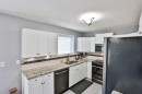 243 N 200 W, Raymond, AB  - Indoor Photo Showing Kitchen With Double Sink 
