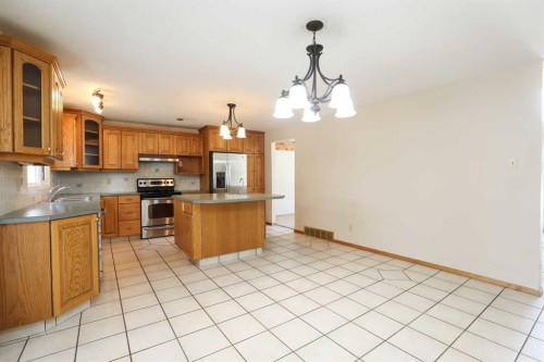 9 Queens Road West, Lethbridge, AB - Indoor Photo Showing Kitchen With Double Sink