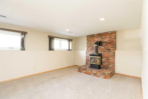 9 Queens Road West, Lethbridge, AB - Indoor With Fireplace