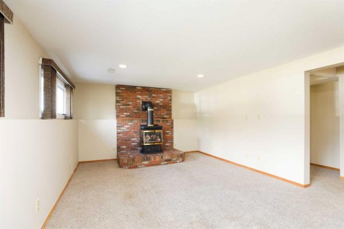 9 Queens Road West, Lethbridge, AB - Indoor With Fireplace