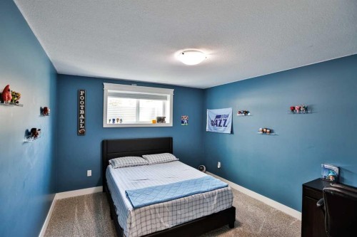 19 S 300 W, Raymond, AB - Indoor Photo Showing Bedroom