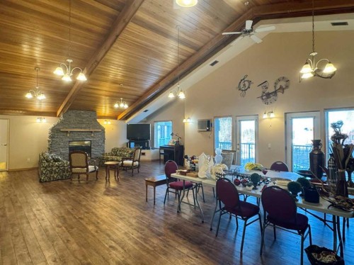 208-75 1 Avenue South, Lethbridge, AB - Indoor Photo Showing Dining Room With Fireplace