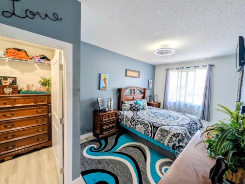 83 Harvest Square, Claresholm, AB - Indoor Photo Showing Bedroom