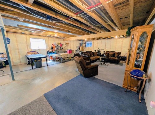 83 Harvest Square, Claresholm, AB - Indoor Photo Showing Basement