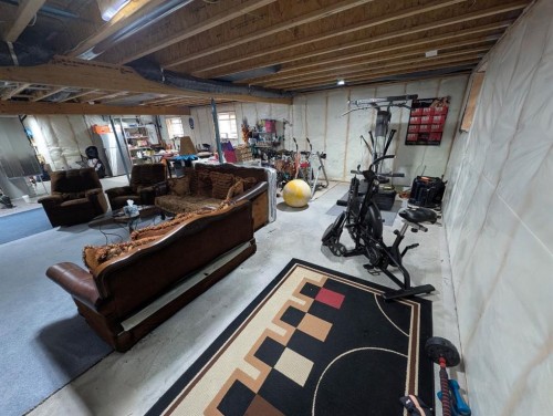 83 Harvest Square, Claresholm, AB - Indoor Photo Showing Basement