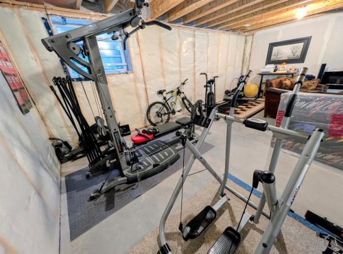 83 Harvest Square, Claresholm, AB - Indoor Photo Showing Gym Room