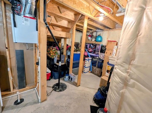 83 Harvest Square, Claresholm, AB - Indoor Photo Showing Basement