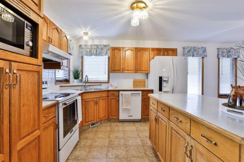 11 Cougar Road North, Lethbridge, AB - Indoor Photo Showing Kitchen With Double Sink