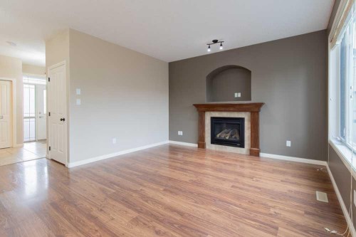 5 Coalbanks Link West, Lethbridge, AB - Indoor Photo Showing Living Room With Fireplace