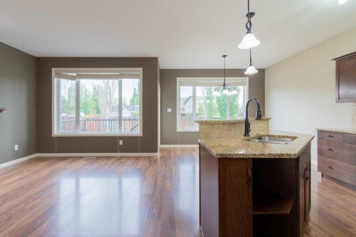 5 Coalbanks Link West, Lethbridge, AB - Indoor Photo Showing Kitchen With Fireplace With Double Sink