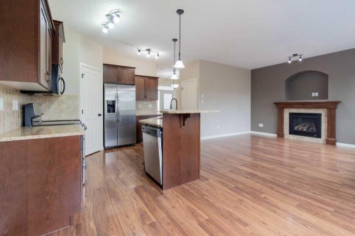5 Coalbanks Link West, Lethbridge, AB - Indoor Photo Showing Kitchen With Fireplace
