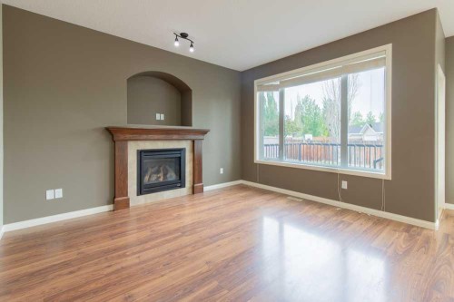 5 Coalbanks Link West, Lethbridge, AB - Indoor Photo Showing Living Room With Fireplace