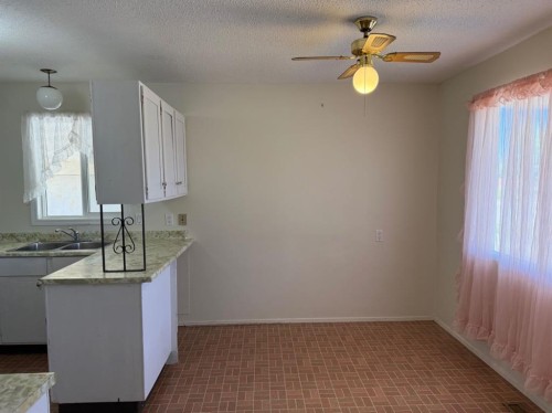 232 Rubie Crescent, Nobleford, AB - Indoor Photo Showing Kitchen With Double Sink