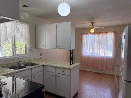 232 Rubie Crescent, Nobleford, AB - Indoor Photo Showing Kitchen With Double Sink