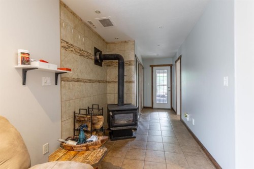 2241 21 Avenue, Coaldale, AB - Indoor With Fireplace