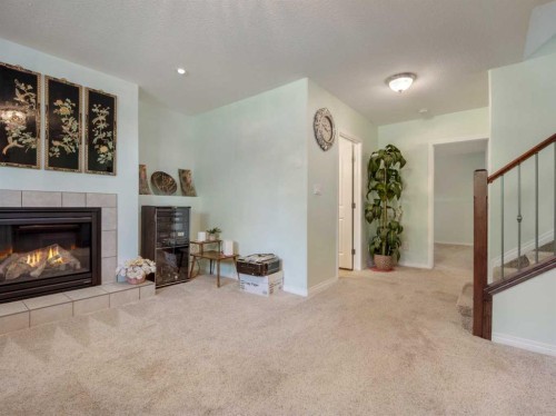 827 Kodiak Bay North, Lethbridge, AB - Indoor Photo Showing Living Room With Fireplace