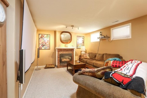 18 Garden Place, Magrath, AB - Indoor Photo Showing Living Room With Fireplace
