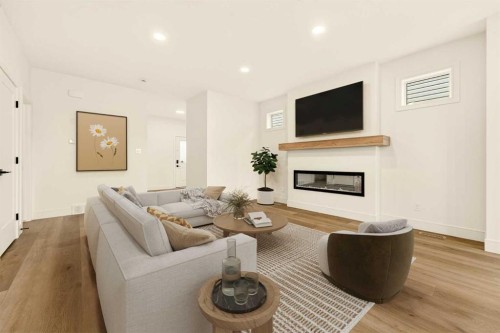3125 44 Street South, Lethbridge, AB - Indoor Photo Showing Living Room With Fireplace