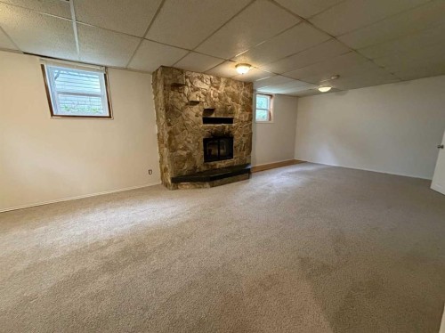 520 20 Street South, Lethbridge, AB - Indoor Photo Showing Other Room With Fireplace