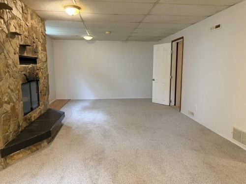 520 20 Street South, Lethbridge, AB - Indoor Photo Showing Other Room With Fireplace