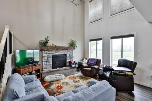 865 Atlantic Cove West, Lethbridge, AB - Indoor Photo Showing Living Room With Fireplace