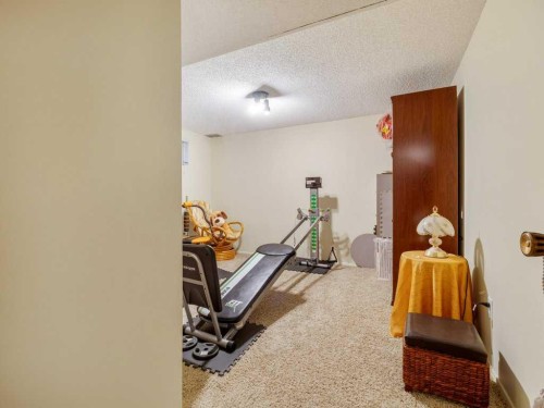 2201 21 Avenue, Coaldale, AB - Indoor Photo Showing Gym Room