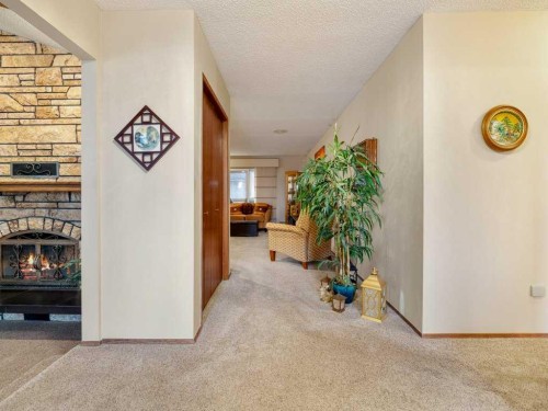 2201 21 Avenue, Coaldale, AB - Indoor Photo Showing Other Room With Fireplace