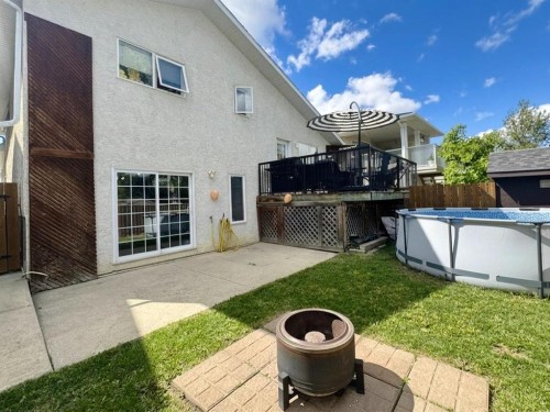 93 Heritage Crescent West, Lethbridge, AB - Outdoor With Above Ground Pool With Deck Patio Veranda With Exterior