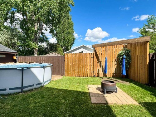 93 Heritage Crescent West, Lethbridge, AB - Outdoor With Above Ground Pool