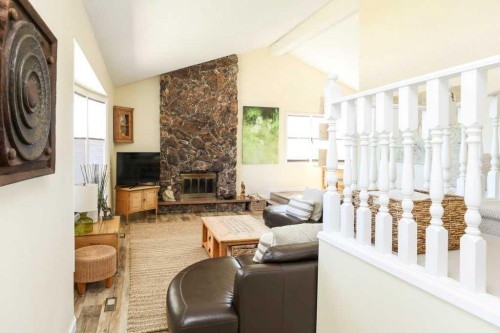 729 Columbia Boulevard West, Lethbridge, AB - Indoor Photo Showing Other Room With Fireplace