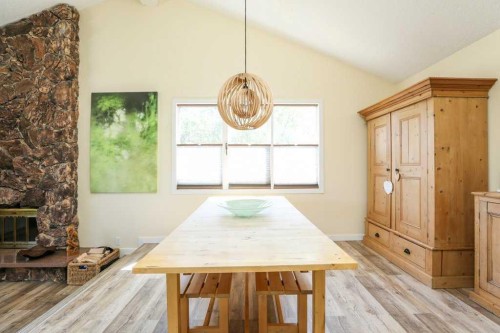 729 Columbia Boulevard West, Lethbridge, AB - Indoor Photo Showing Dining Room With Fireplace