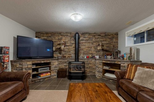 325 8 Avenue, Granum, AB - Indoor Photo Showing Living Room With Fireplace
