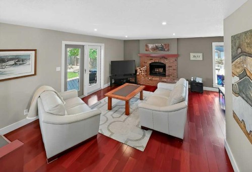 63 Wildwood Crescent West, Lethbridge, AB - Indoor Photo Showing Living Room With Fireplace